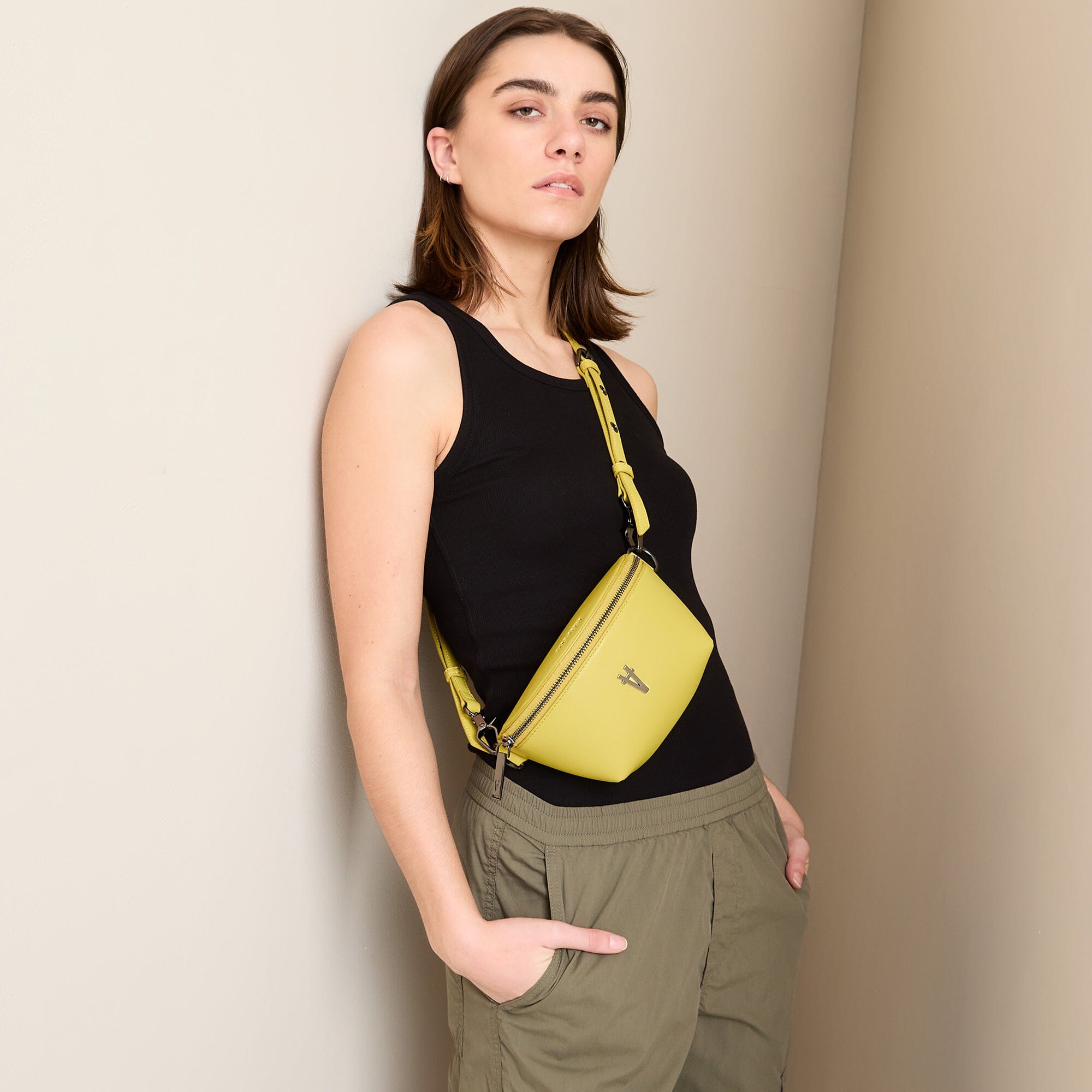 Tiny Spark Vegan Crossbody Bag Yellow worn crossbody