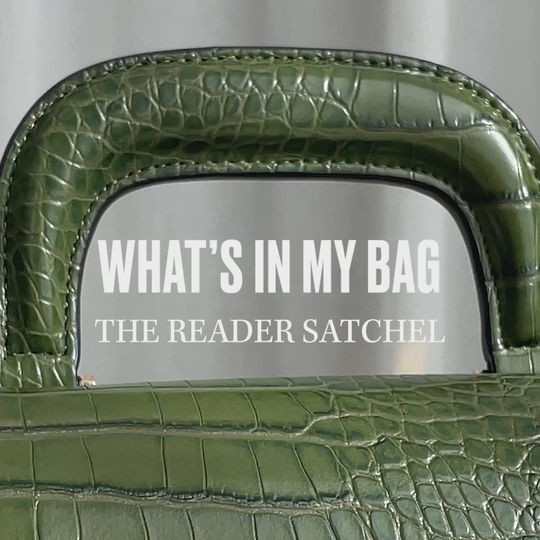 A video of the Olive Reader Satchel being packing with items such as a phone and wallet.