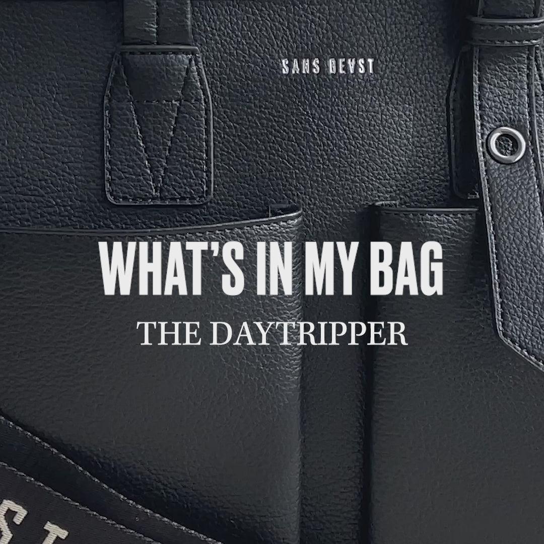 A video of the Noir Daytripper being packing with items such as a towel and water bottle.