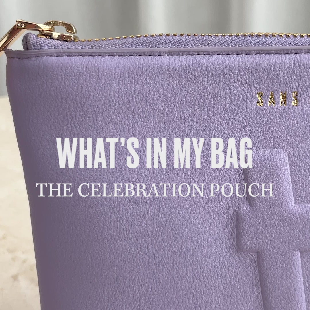 A video of the Lavender Celebration pouch being packed with items such as a phone and wallet